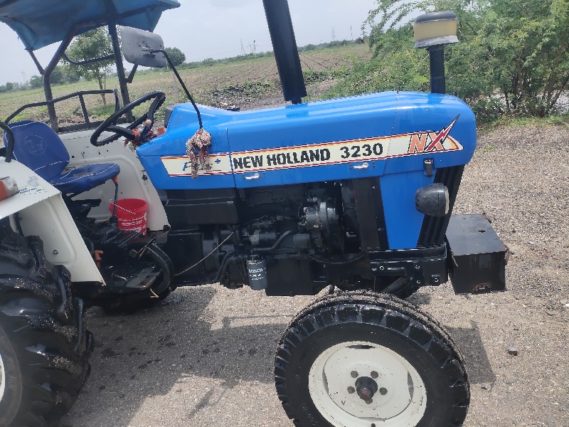 New Holland 323...