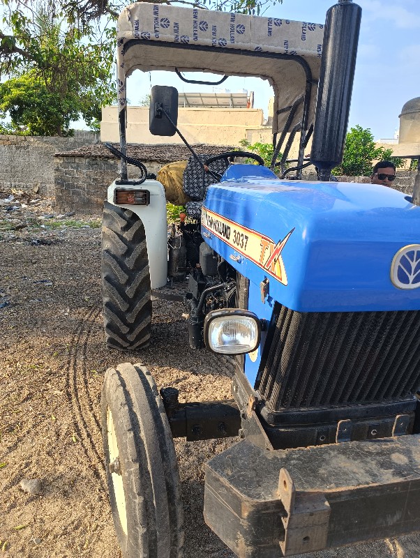 New Holland 303...