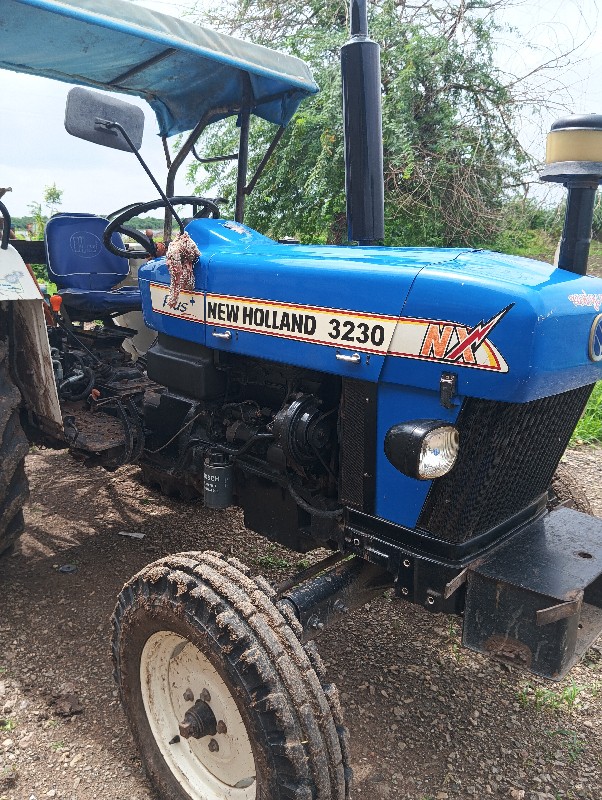 New Holland 323...