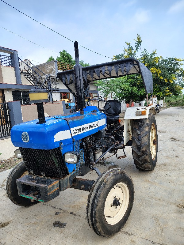 New Holland 323...